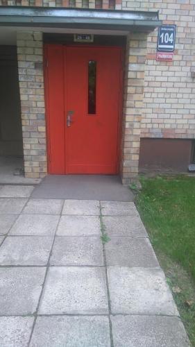 a red door of a building with a red door at Brivibas Avenue Apartment in Jūrmala
