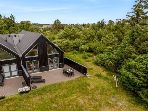 an overhead view of a black house with a patio at Holiday Home Anelle - 2-5km from the sea by Interhome in Blokhus
