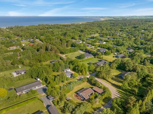 an aerial view of a subdivision of houses and trees at Holiday Home Laris - 700m to the inlet by Interhome in Løgsted