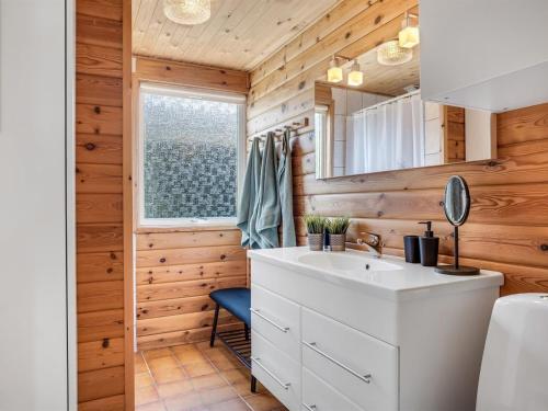 a bathroom with a sink and a window at Holiday Home Laris - 700m to the inlet by Interhome in Løgsted