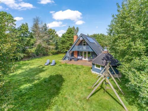 an overhead view of a house with a telescope at Holiday Home Hannele - 10km from the sea by Interhome in Oksbøl