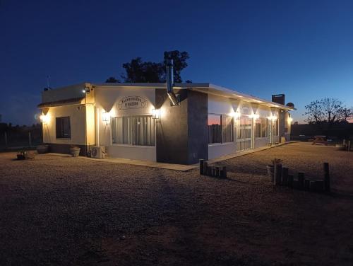 a building with lights on it at night at La Martinna 3 in Trinidad