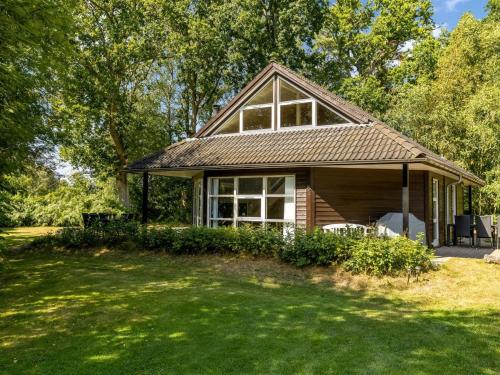 a house with a large yard in front of it at Holiday Home Hristijan - 4-8km from the sea by Interhome in Læsø