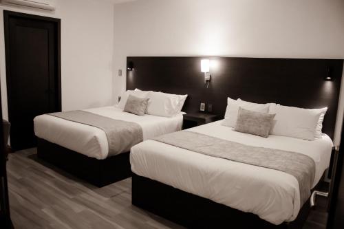 Hotel Del Centro HCにあるベッド