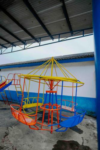 a group of play equipment in a building at Mbeya Forest Hill Motel in Mbeya