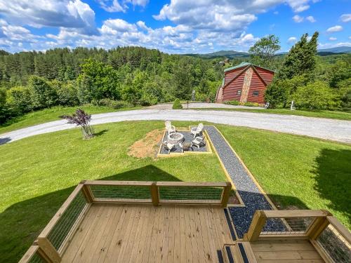 an aerial view of a yard with a picnic table and a barn at Logged Out in Piney Creek