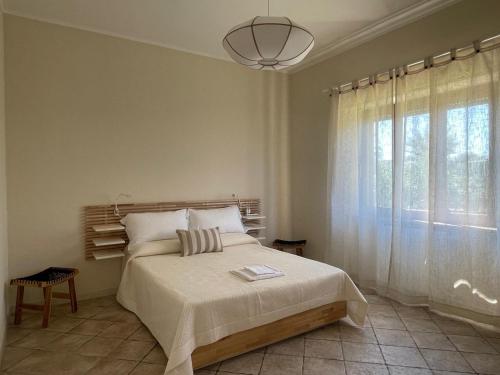 Ένα ή περισσότερα κρεβάτια σε δωμάτιο στο Fronte Mare Suite & Terrazza