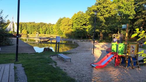 a playground with a slide in a park at Zofia in Struga