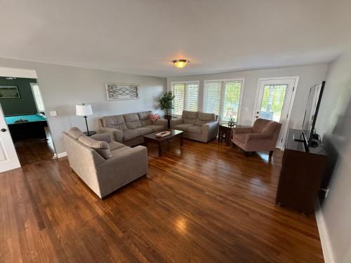 a living room with two couches and a television at Wine Down in Hammondsport