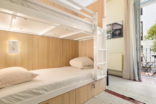 Ένα ή περισσότερα κρεβάτια σε δωμάτιο στο Hostel Anguita