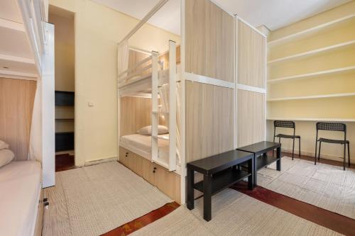 Ένα ή περισσότερα κρεβάτια σε δωμάτιο στο Hostel Anguita