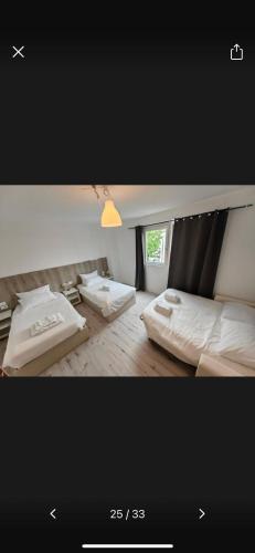 a bedroom with two beds and a window at MILANFORESTER in Milan