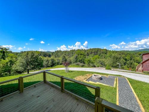 a large deck with a view of a yard at Logged Out in Piney Creek