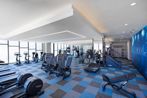 a gym with several treadmills and exercise bikes at Hard Rock Hotel Los Cabos in Cabo San Lucas