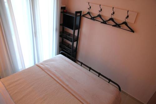 a bedroom with a bed and a window at SiviriLovelyApartment in Siviri