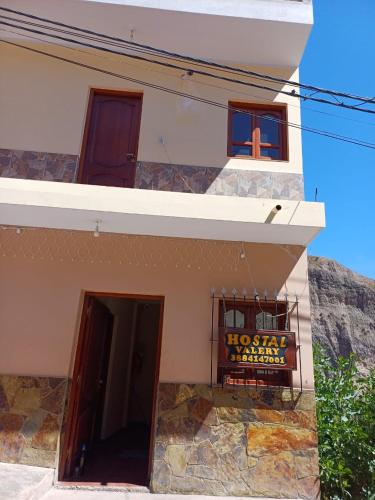 a building with a cross on the side of it at Hostal Valery in Iruya