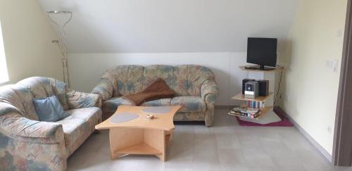 Ruang duduk di Ferienwohnung Eifelglück Hupperath