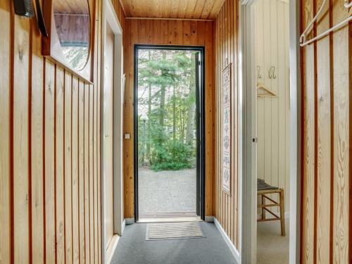 an empty hallway with a door in a house at Holiday Home Juditha - 400m from the sea by Interhome in Middelfart