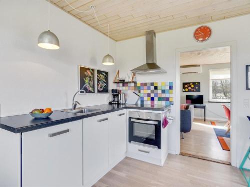 a kitchen with a sink and a stove top oven at Holiday Home Ewelina - 15km from the sea by Interhome in Ballum