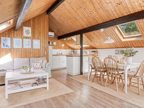 a living room with a white couch and a table at Holiday Home Hilla - 31km from the sea by Interhome in Toftlund
