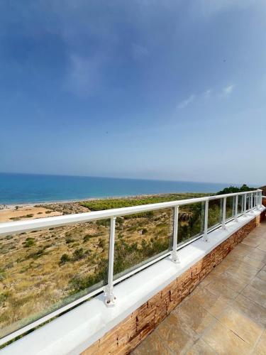 a balcony with a view of the ocean at Roger's house frente al mar en Alicante in Gran Alacant