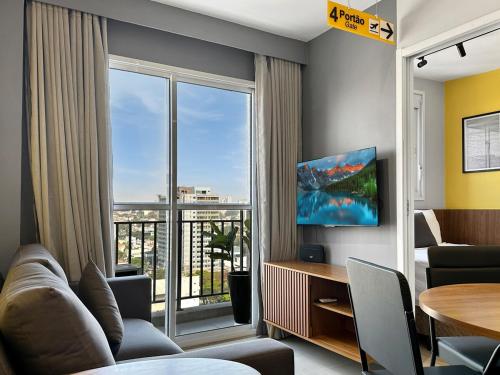 a living room with a large window with a view at 2 quartos - AC - Home office - WiFi in Água Boa