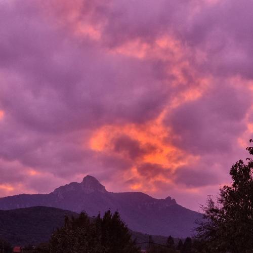 a sunset with a mountain in the background at Indigo Dreams in Ogulin