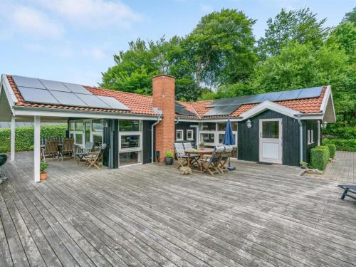 a house with solar panels on a deck at Holiday Home Algot - 100m to the inlet by Interhome in Børkop