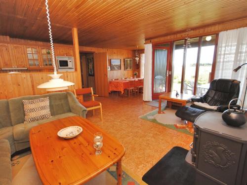 a living room with a couch and a table at Holiday Home Neven - 900m from the sea by Interhome in Torsted
