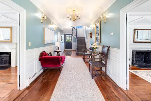 a living room with chairs and a fireplace at The Hill in Providence