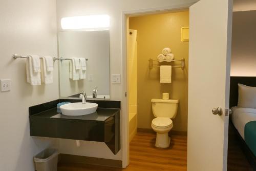 a bathroom with a sink and a toilet at Motel 6-Duluth, MN in Duluth