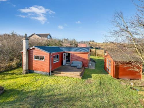 a home with a deck and a house at Holiday Home Alpi - 250m to the fjord by Interhome in Struer