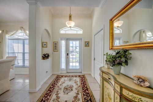 a hallway with a mirror and a door at 16684 Wellington in Biggar