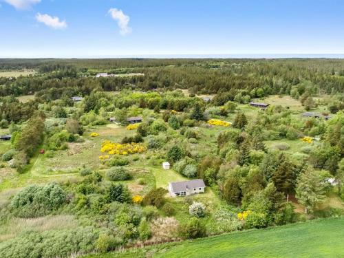 an aerial view of a farm with a house and trees at Holiday Home Aameek - 3km from the sea by Interhome in Frøstrup