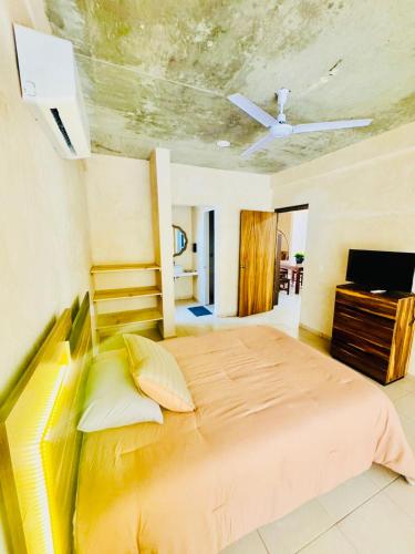 Ένα ή περισσότερα κρεβάτια σε δωμάτιο στο Casa Tachu