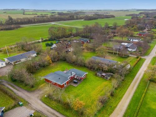 an aerial view of a house in a field at Holiday Home Scarlet - 400m to the inlet by Interhome in Vinderup
