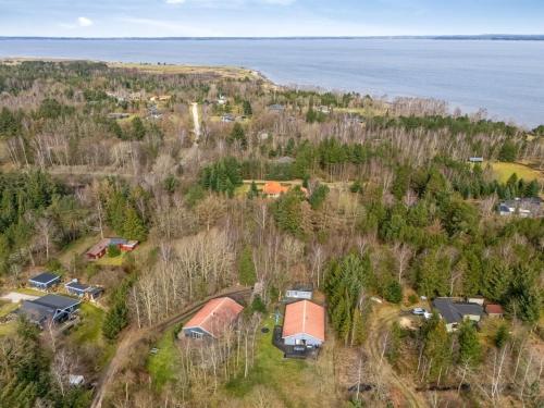 an aerial view of a house on a hill next to the water at Holiday Home Anine - 200m to the fjord by Interhome in Højslev