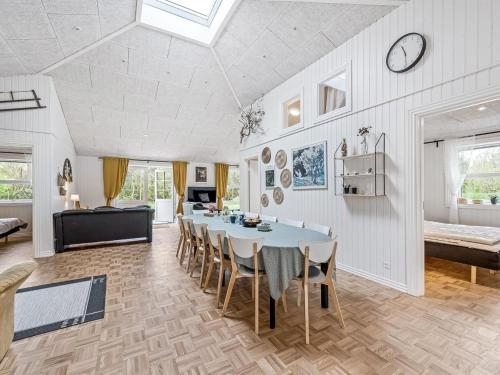 a dining room with a table and chairs at Holiday Home Veijo - 400m to the fjord by Interhome in Spottrup