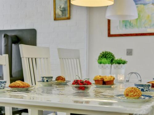a table with plates of food on top of it at Holiday Home Deik - 2km to the fjord by Interhome in Vester Jølby