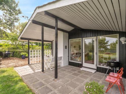 a screened in porch of a house at Holiday Home Suoma - 400m to the fjord by Interhome in Roslev