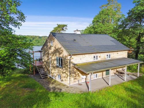 an overhead view of a large stone house with a porch at Holiday Home Gertje by Interhome in Bryrup