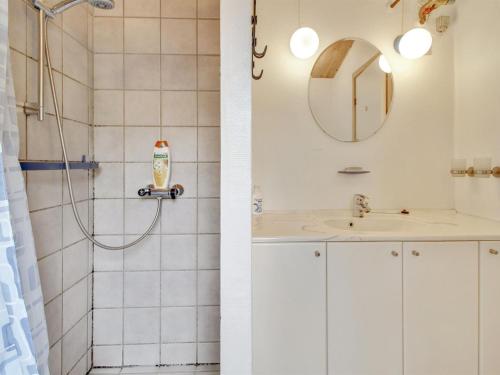 a bathroom with a shower and a sink at Holiday Home Graa by Interhome in Skanderborg