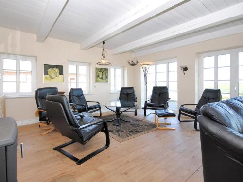 a living room with chairs and a table at Holiday Home Alois - 1km to the fjord by Interhome in Hesselbjerg