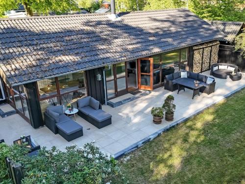 an overhead view of a patio with chairs and tables at Holiday Home Gustine - 300m from the sea by Interhome in Egå