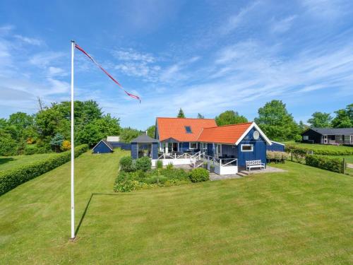 a house with a kite in the yard at Holiday Home Edvia - 700m to the fjord by Interhome in Løgstrup