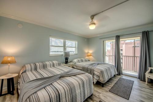 a bedroom with two beds and a window at Vacation Villas #531 in Fort Myers Beach
