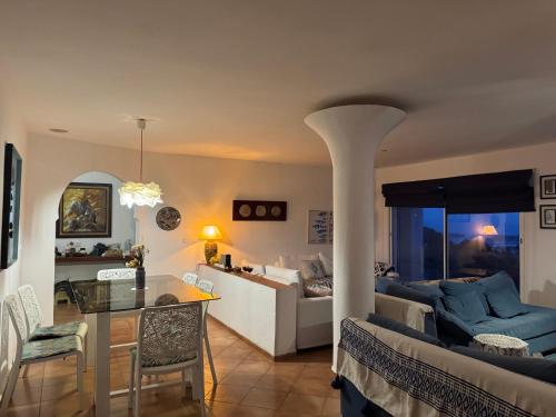 a kitchen and living room with a couch and a table at Luxury, quiet and pleasure with lagoon view in Oualidia