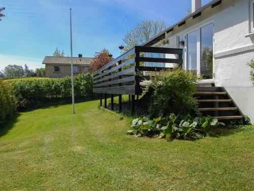 a house with a staircase and some plants next to it at Holiday Home Melina - 100m from the sea by Interhome in Malling
