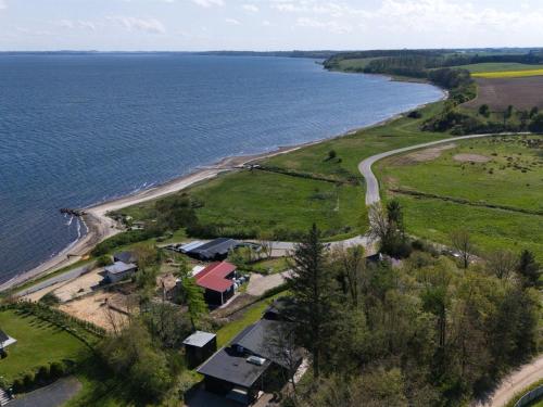 an aerial view of the shoreline of a lake at Holiday Home Elissa - 50m to the fjord by Interhome in Roslev
