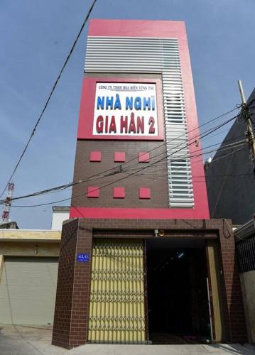 a building with a sign that reads nima natalcli man at Gia Han Guesthouse in Vung Tau